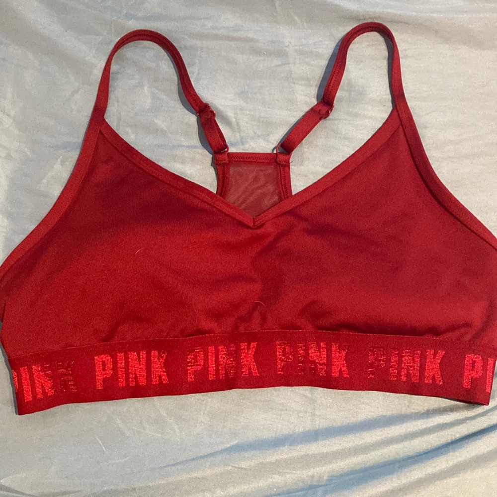 I am selling a Burgundy pink sports bra size M it was bought but never worn